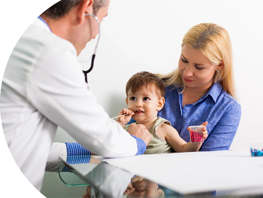 A doctor and nurse examining a baby.